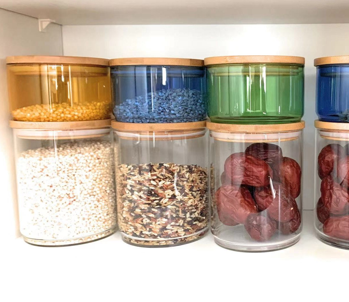 Glass storage jars set. Stackable glass jar, big clear + small color with natural wood. Small glass can be stackable on wooden.