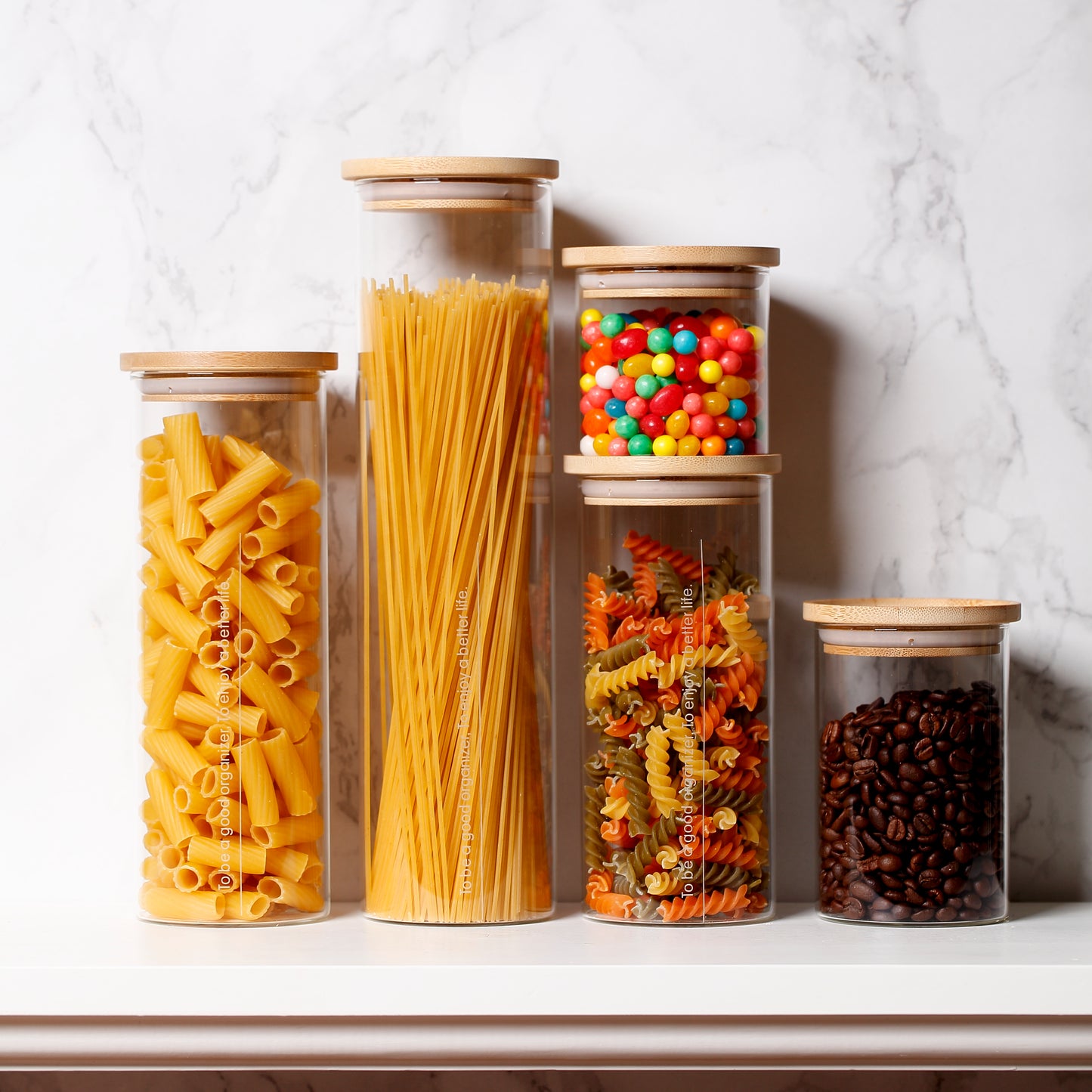 Glass storage jars set. Stackable glass jar with natural wood