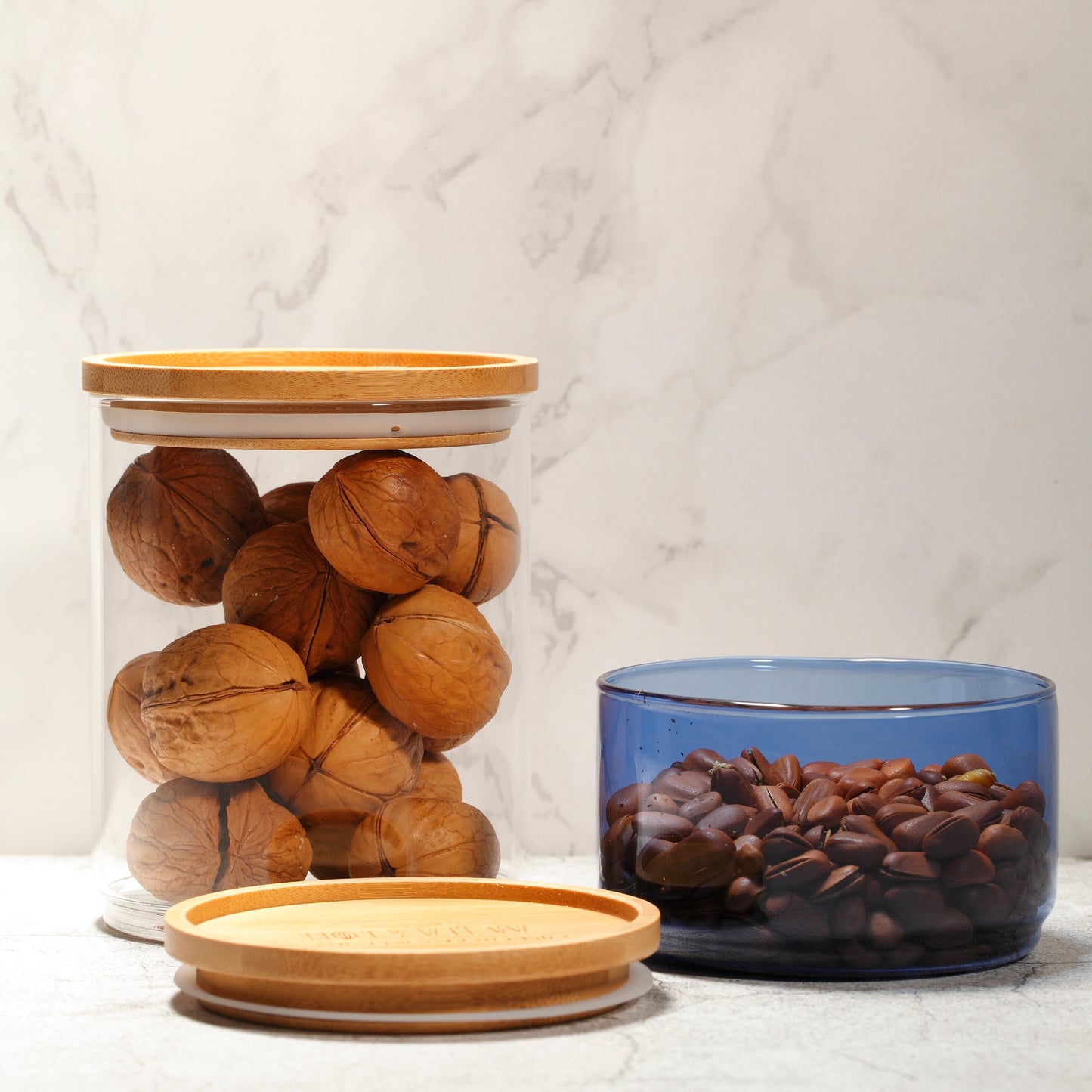 Glass storage jars set. Stackable glass jar, big clear + small color with natural wood. Small glass can be stackable on wooden.