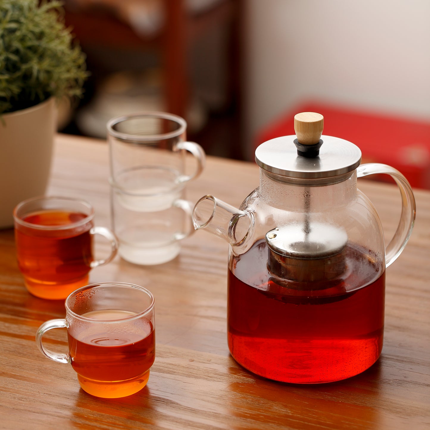 Heat resistant borosilicate glass 1.5L teapot with centered ss filter + foldable lift-up handle